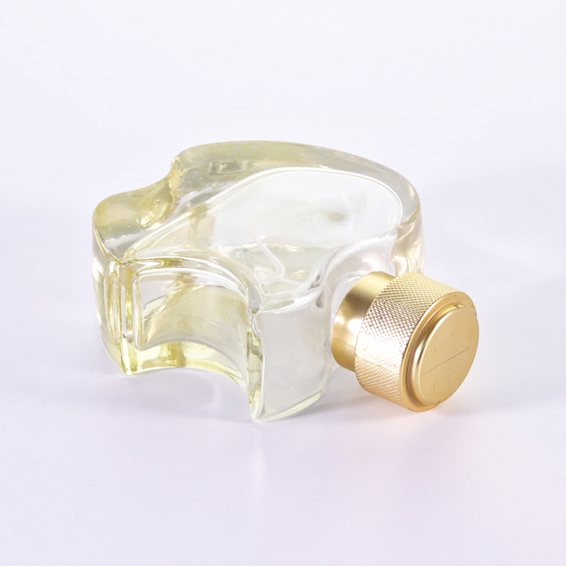 Empty Yellow Glass Cologne Bottle
